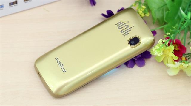Máy còn màu vàng đồng, trắng và đen
